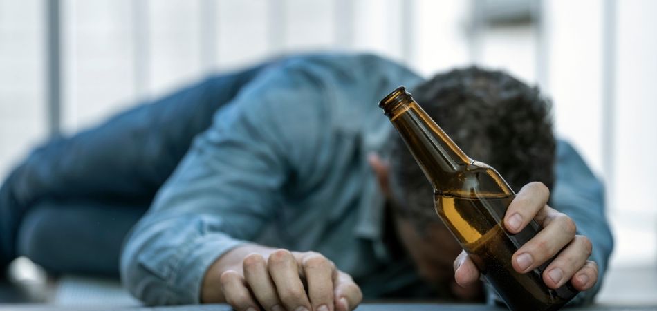 Alcoholic parent lying on the floor